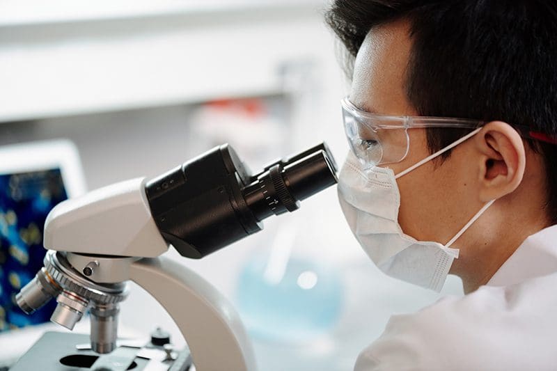 Man with microscope