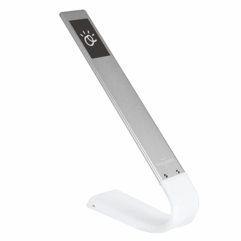 Sleek silver EMF protection meter with digital display, angled on white curved stand