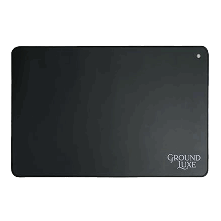 Black rectangular Ground Luxe EMF protection mat with rounded corners and subtle logo text