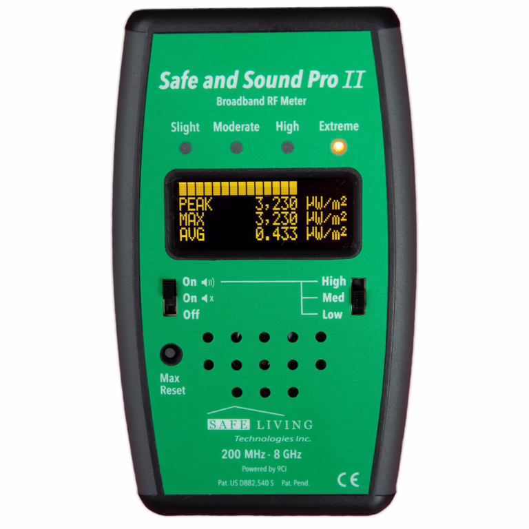 Green Safe and Sound Pro II EMF meter with digital yellow display showing measurement readings and black control buttons